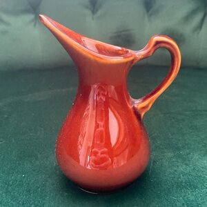 Small pottery creamer. ￼